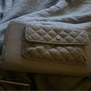 selling a Jones New York wallet with a stylish pen. message me with any details.